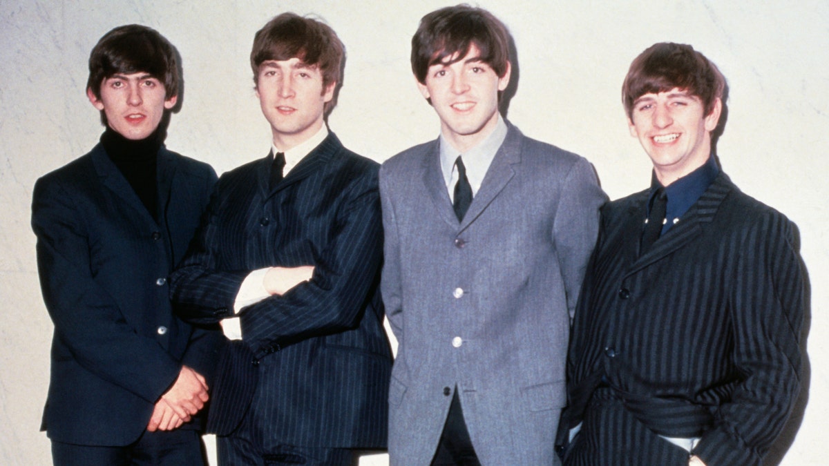 The Beatles, George Harrison, John Lennon, Paul McCartney and Ringo Starr pose for a photo around 1965
