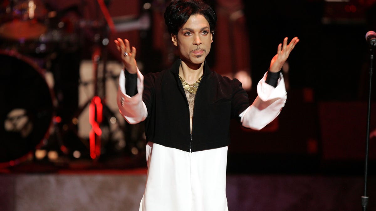 Prince on stage with arms out