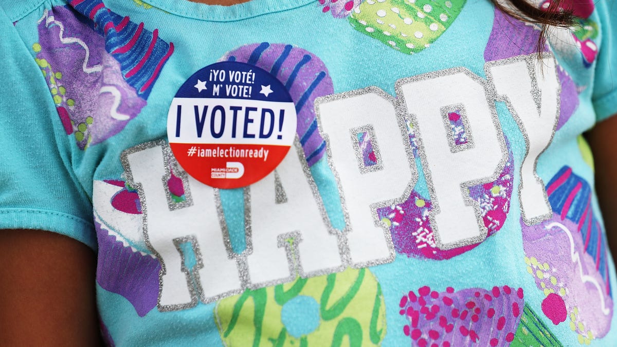 A child wears a, 'I Voted!', sticker after her mother voted in the Florida primary on August 30, 2016 in Miami, Florida. 