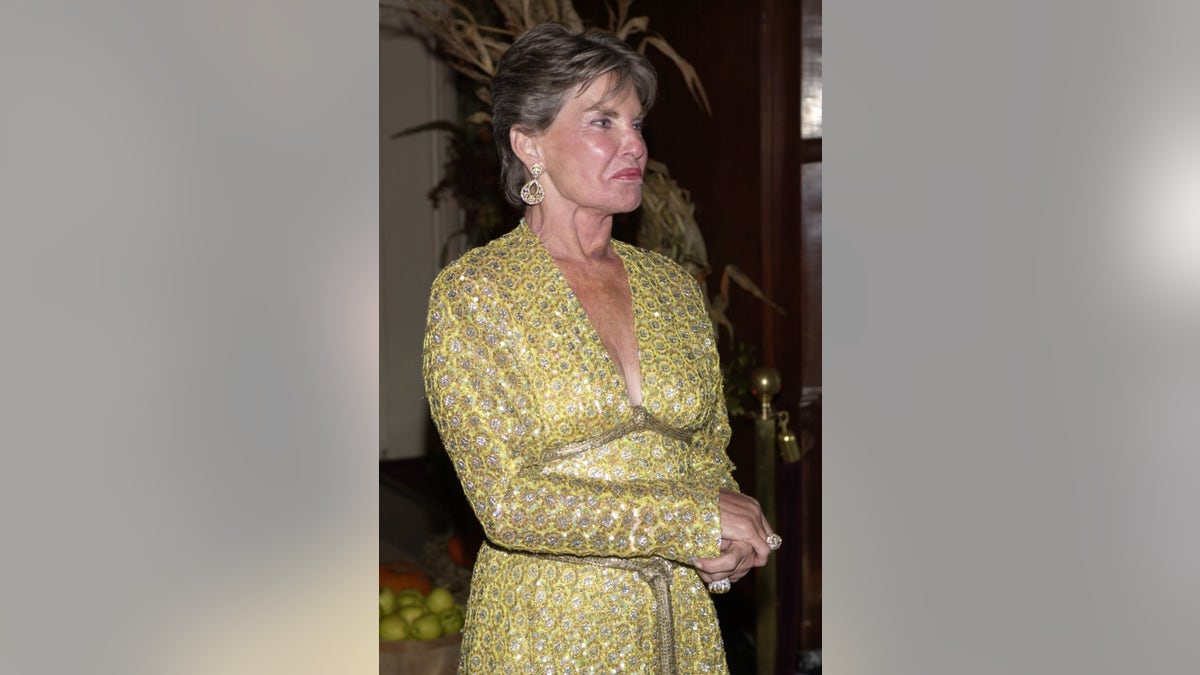 Leona Helmsley in a gold dress