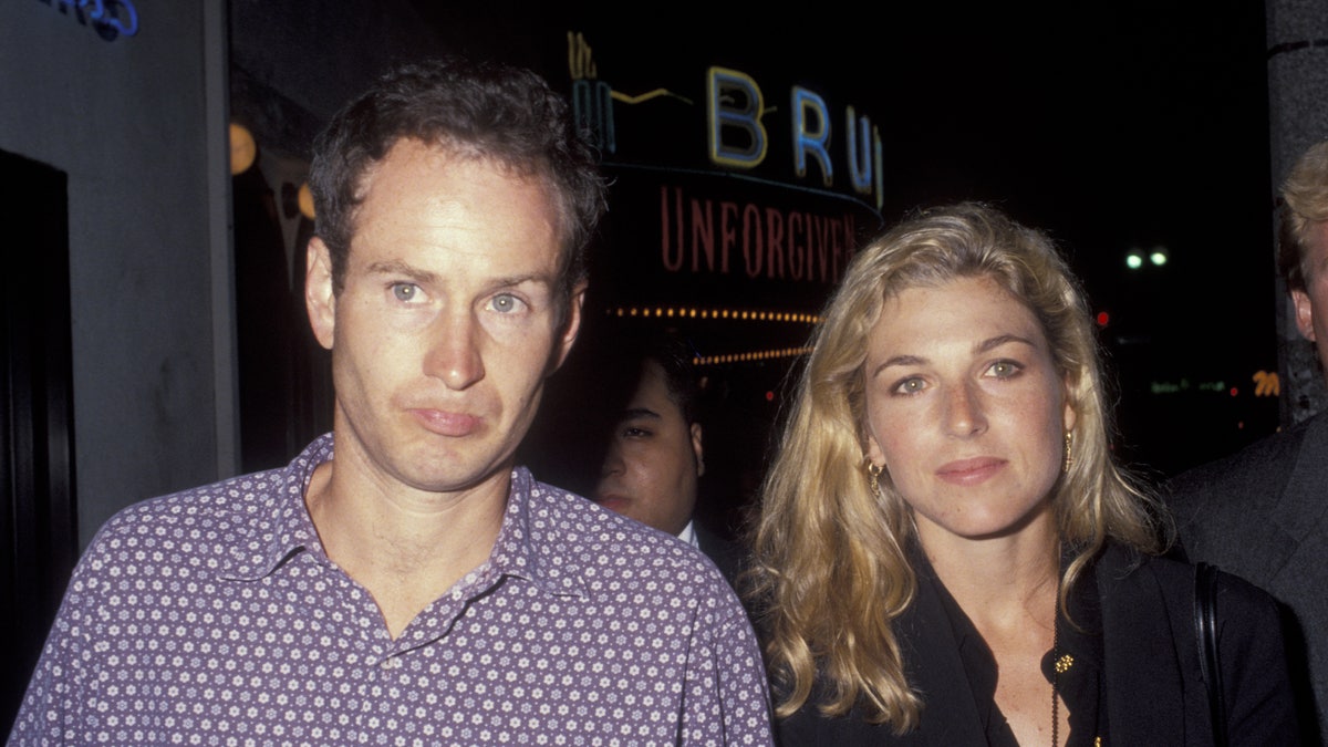 John McEnroe and Tatum O'Neal walking together