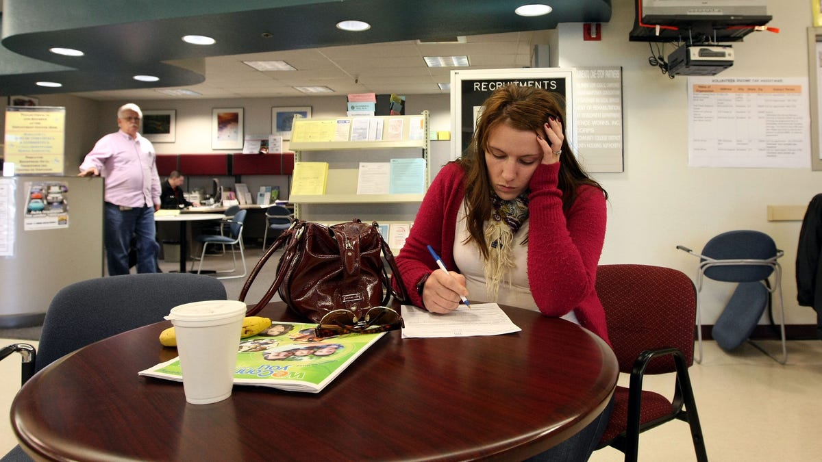 Brittney Nance fills out an application for food stamps at the Yolo County Department of Employment & Social Services, March 6, 2009 in West Sacramento, California.