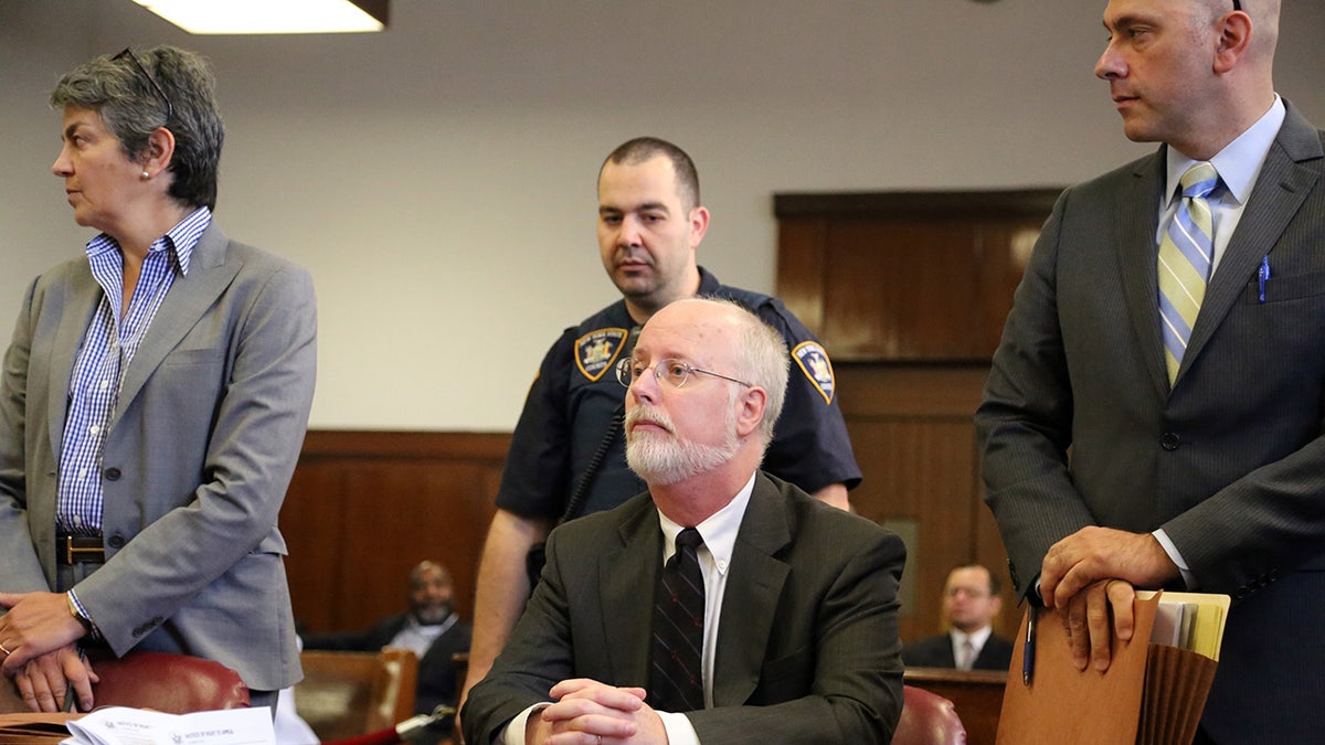 Robert Hadden sat at a table during court hearing