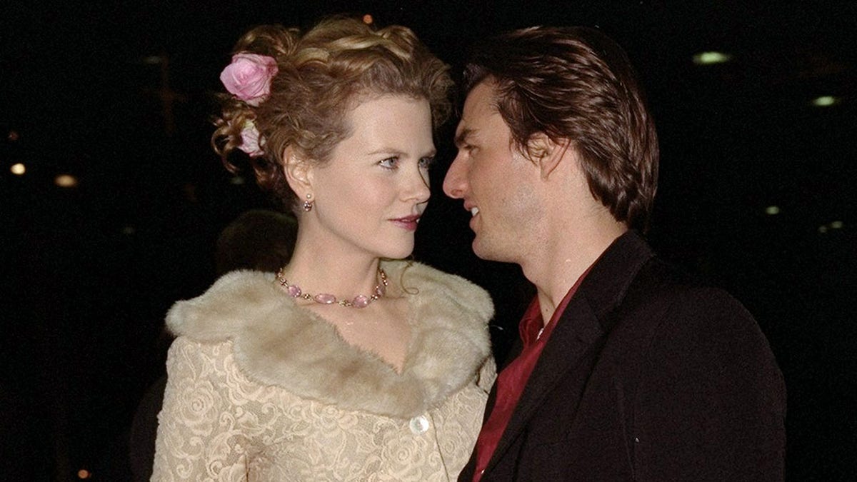 An old photo of Nicole Kidman and Tom Cruise cozied up together.