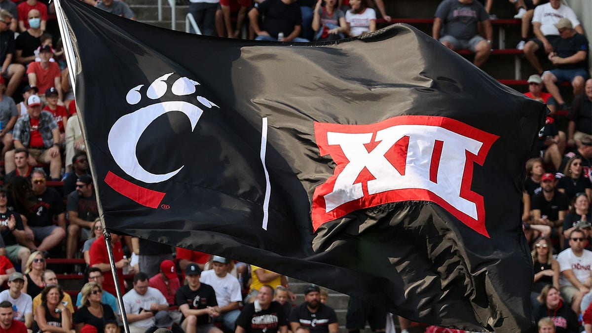 A Cincinnati Bearcats flag flies at a football game
