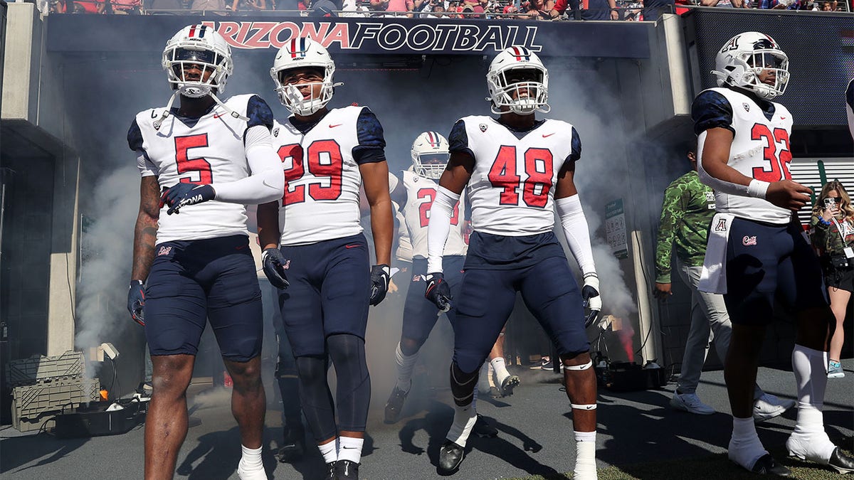The Arizona Wildcats take the field before a game against Washington State
