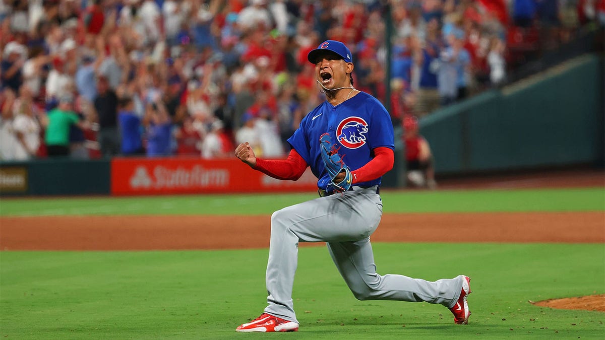 Adbert Alzolay reacts after beating the Cardinals