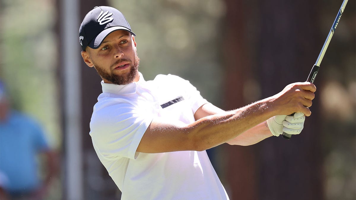 Stephen Curry hits a tee shot at a celebrity golf tournament