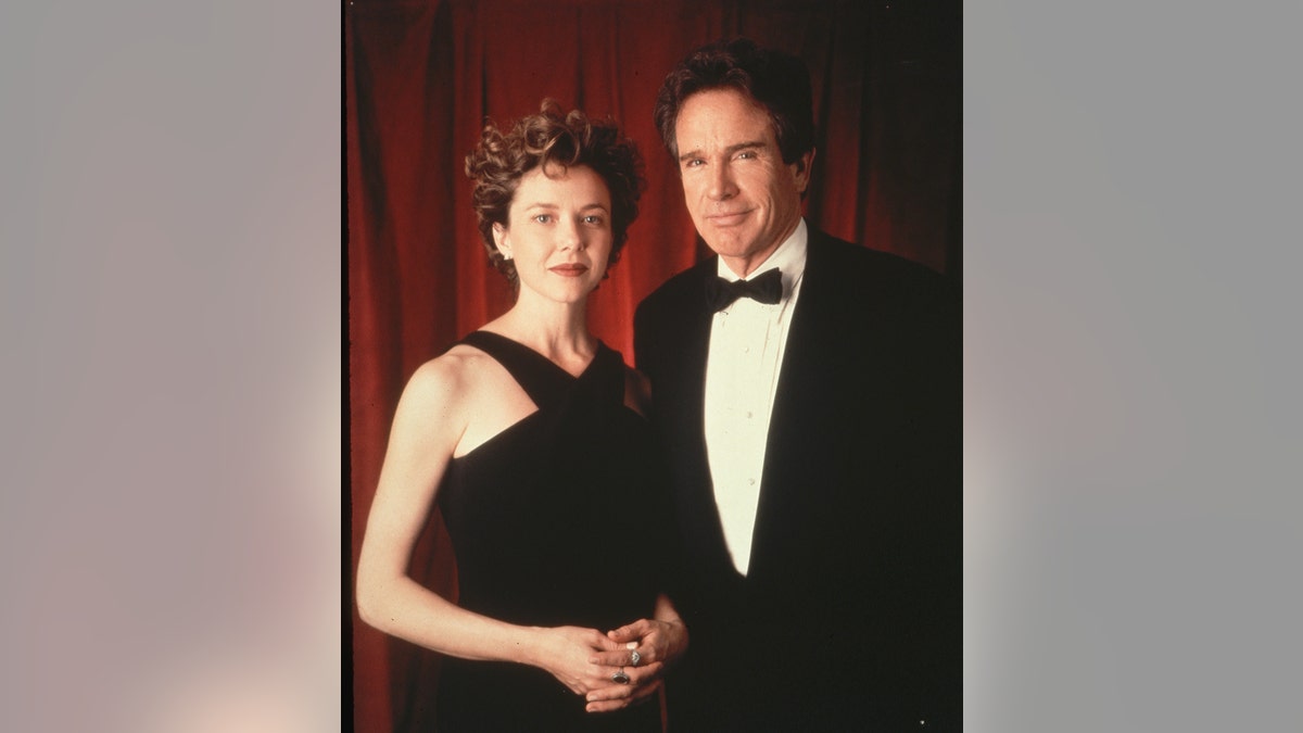 Warren Beatty and Annette Bening wearing matching black formal wear