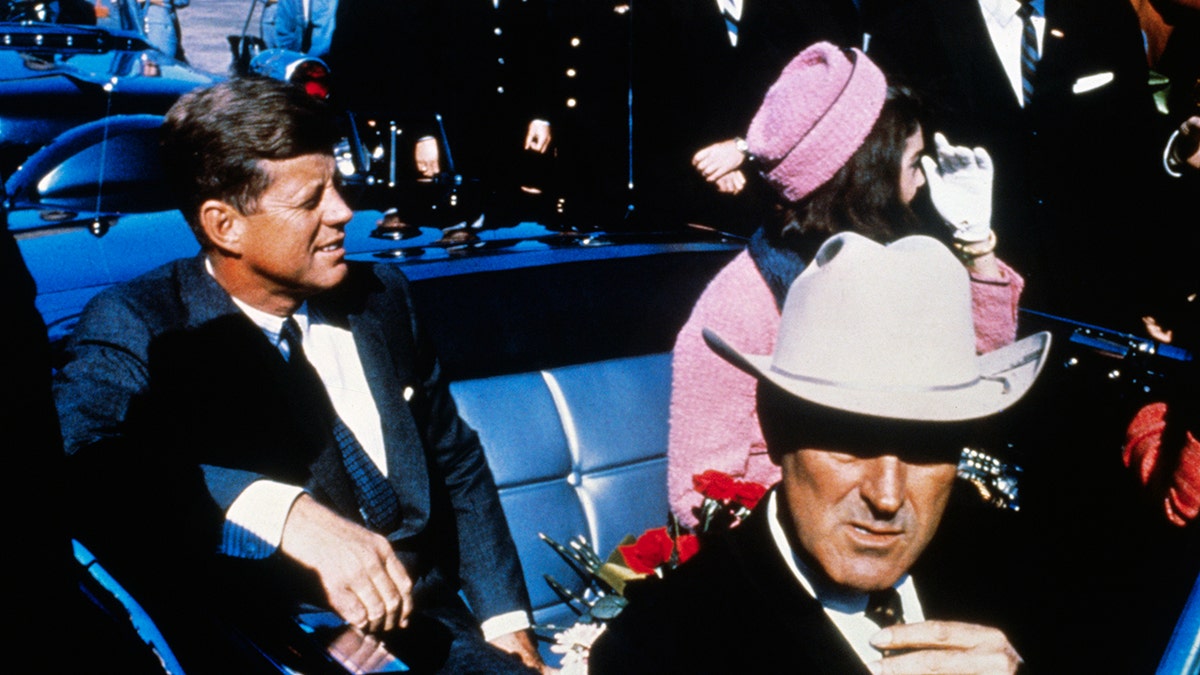 JFK and Jackie Kennedy sitting next to each other in Texas before the president was assassinated