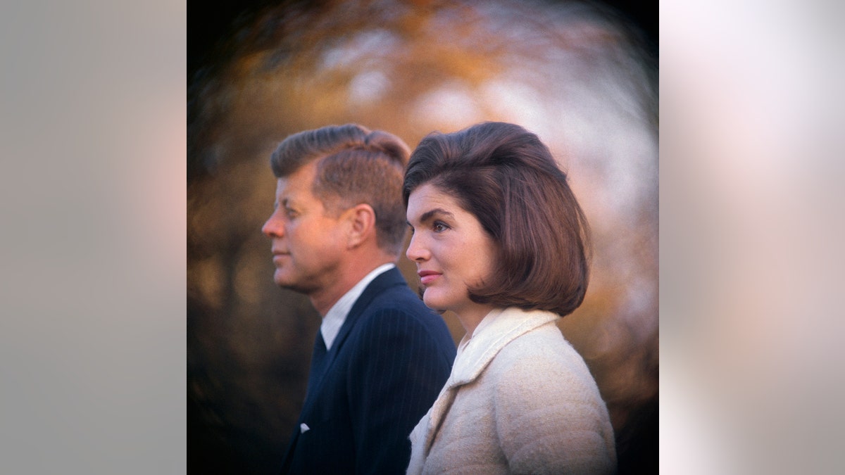 A close-up of President JFK and Jackie Kennedy looking away from the camera wearing formal attire