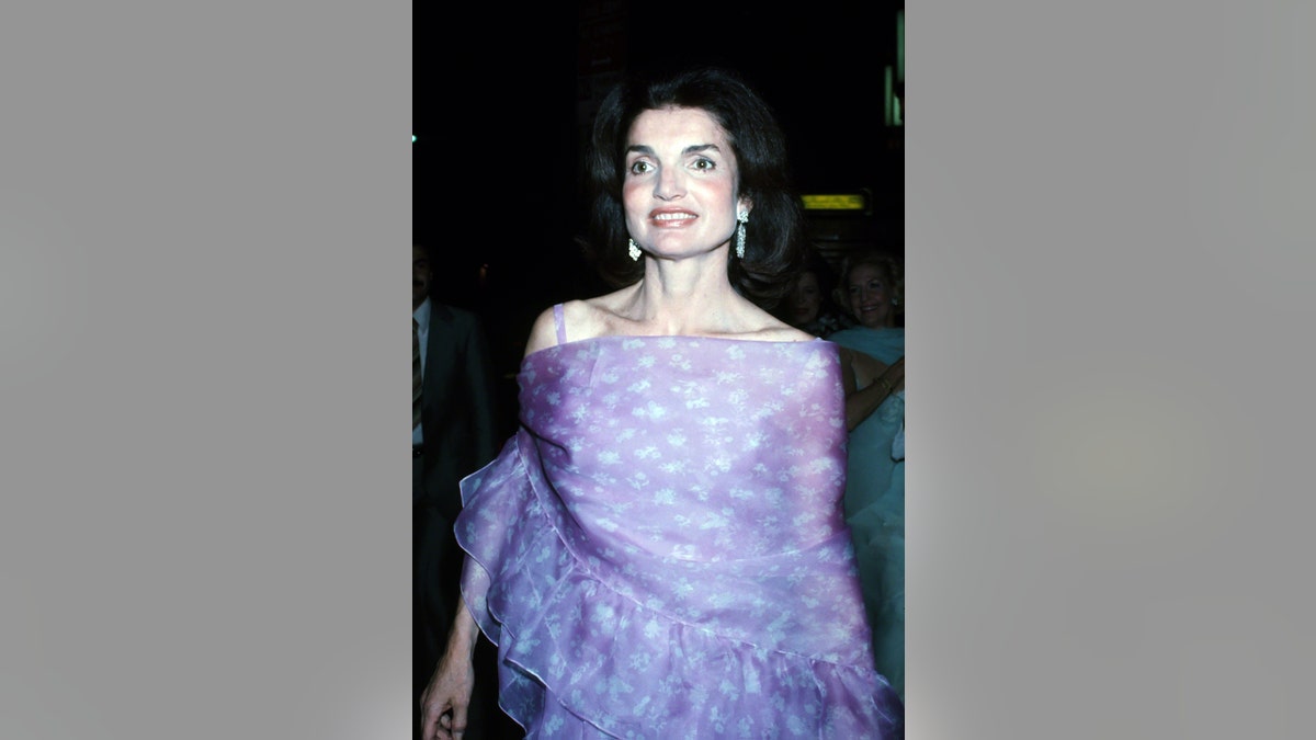 Jackie Kennedy wearing a formal lavendar gown