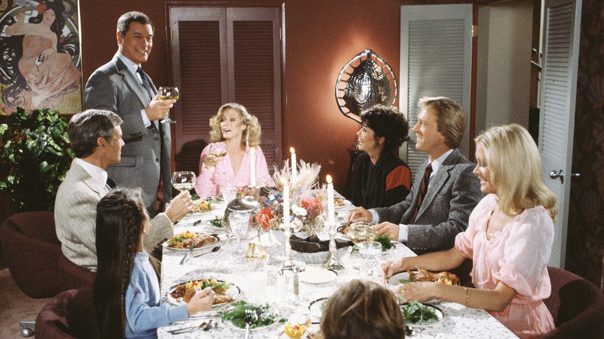 A dinner scene from Knots Landing where Larry Hagman makes a toast