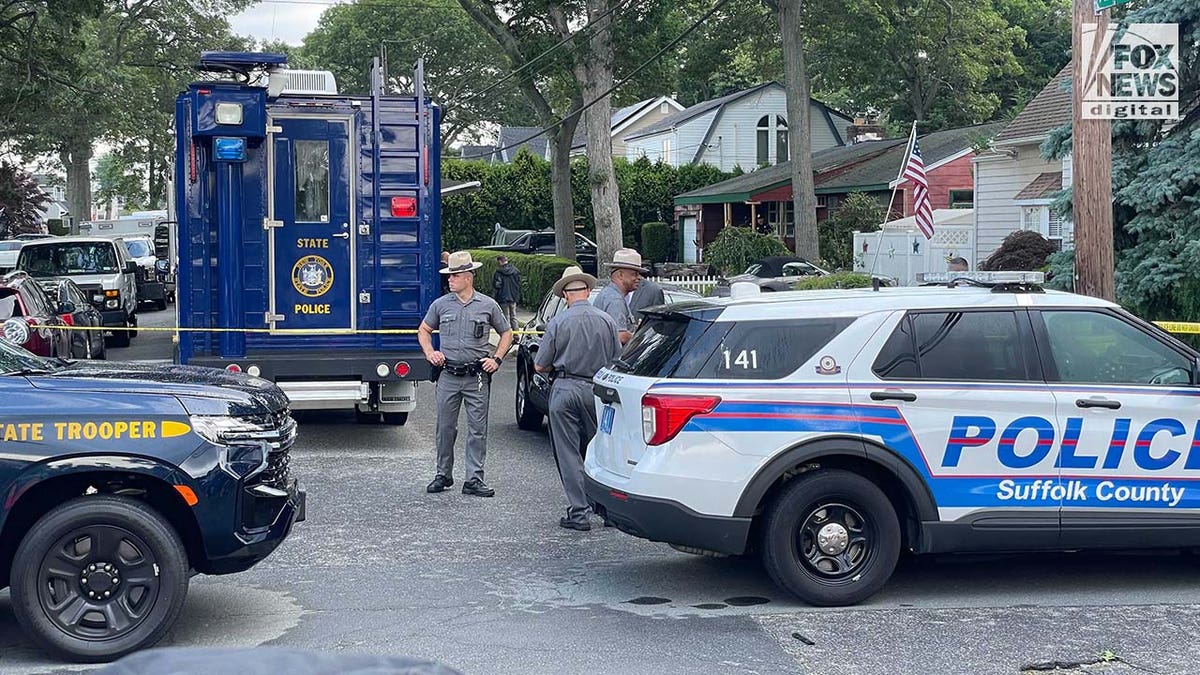 Suffolk County police stationed outside of a home in Massapequa Park