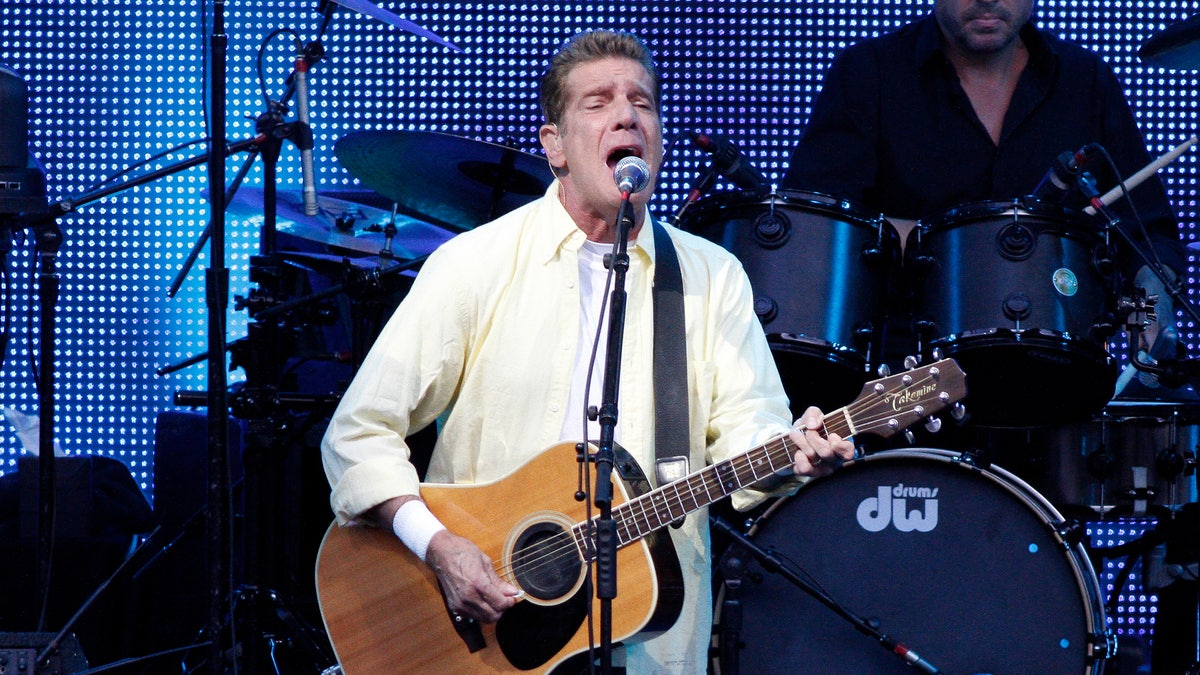 Glenn Frey singing and playing guitar