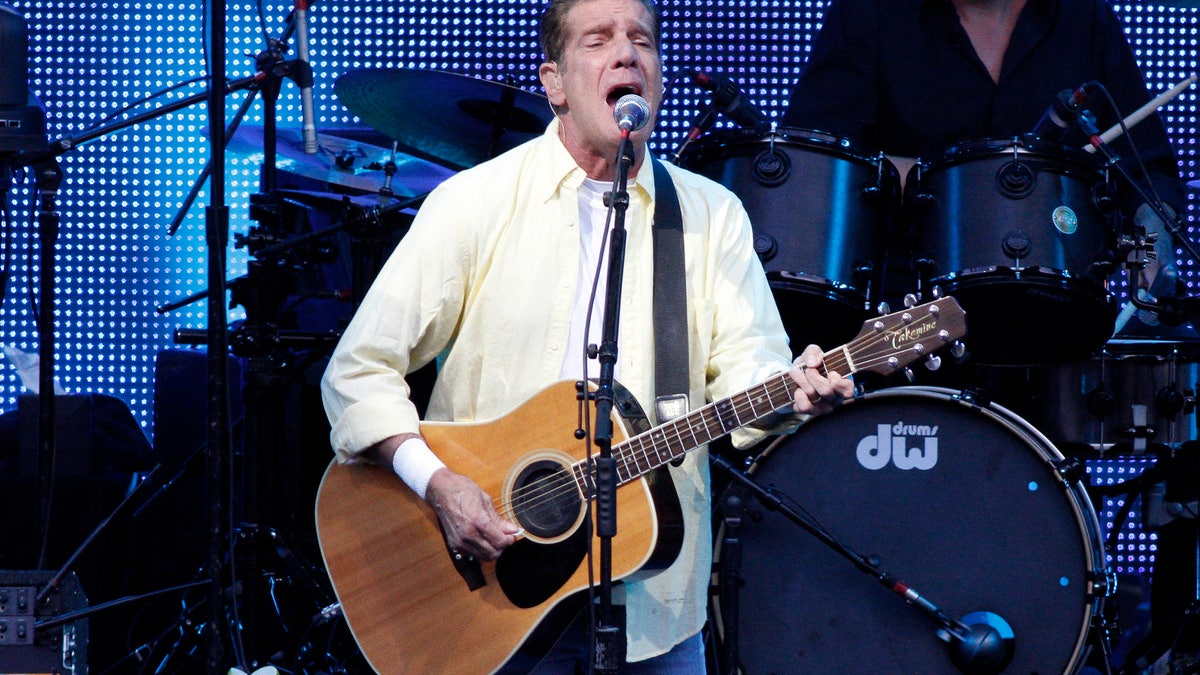 Glenn Frey singing and playing guitar