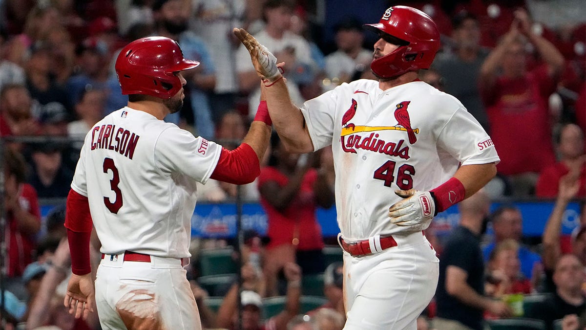 Paul Goldschmidt and Dylan Carlson celebrate