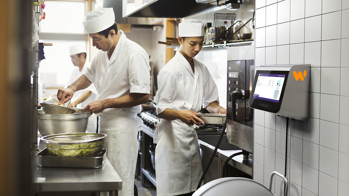 chefs at a sushi restaurant