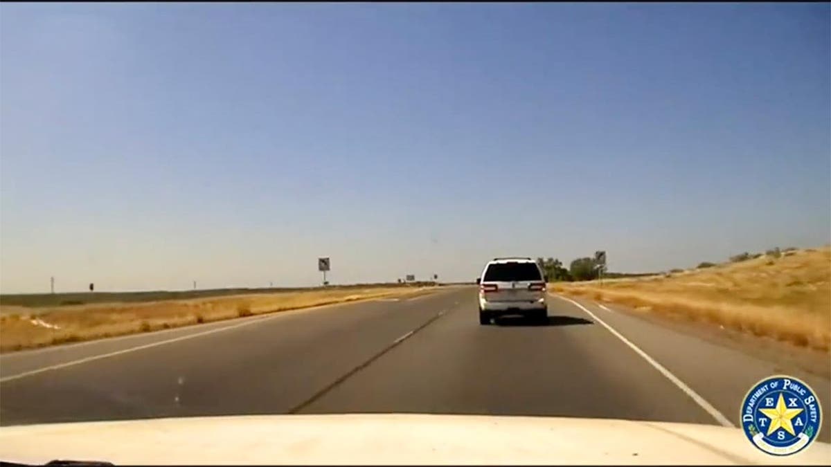 Police dashcam footage of a SUV