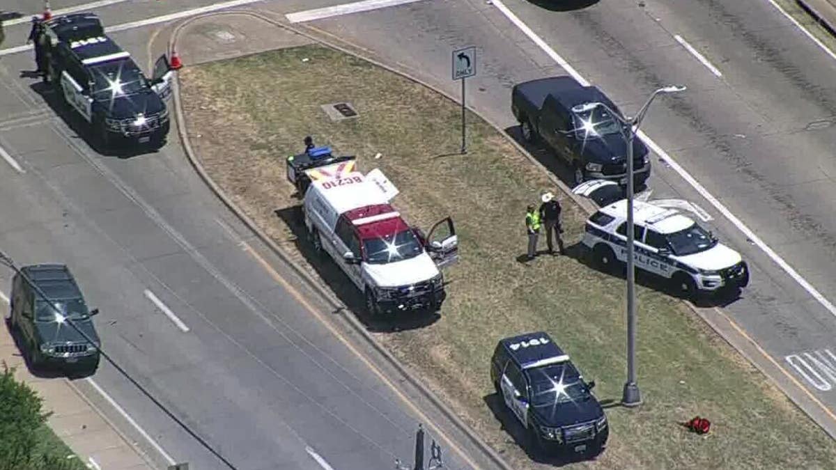 Medical personnel at scene of crash following shooting at Methodist Family Health Center