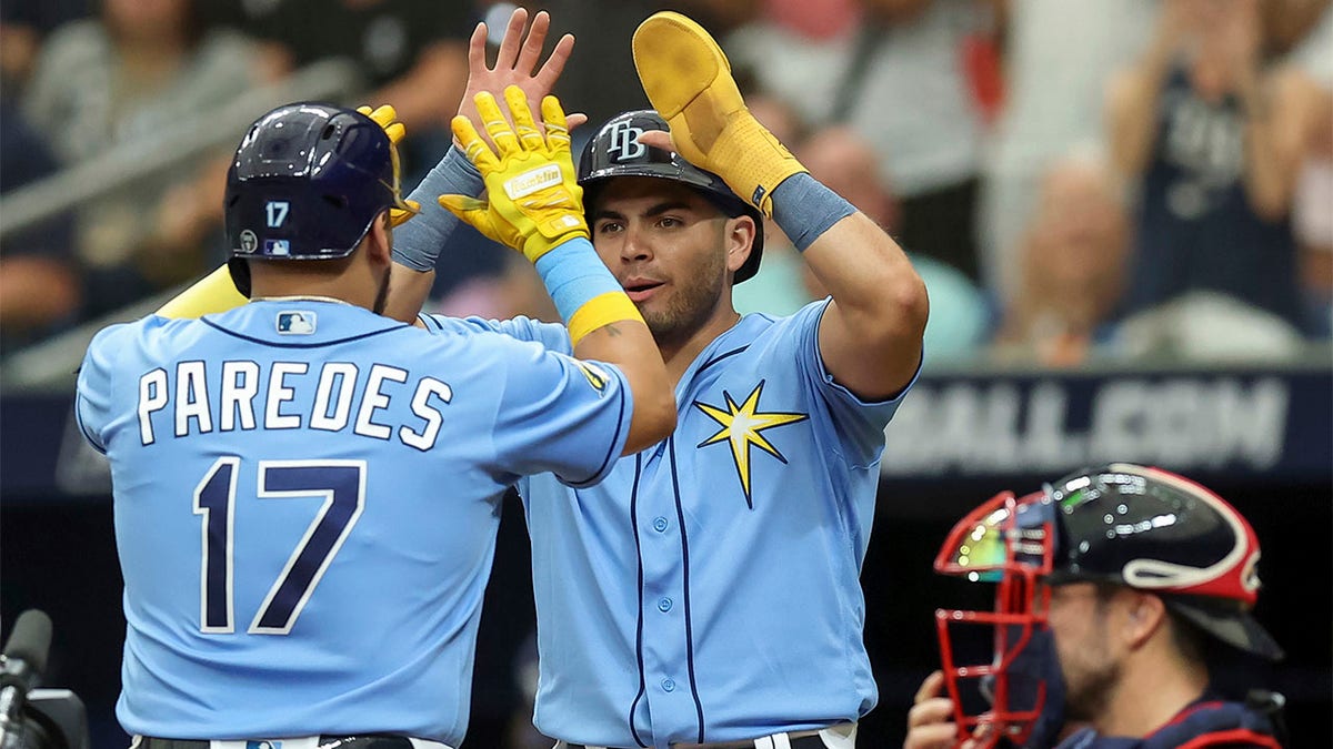 Isaac Paredes celebrates with Jonathan Aranda