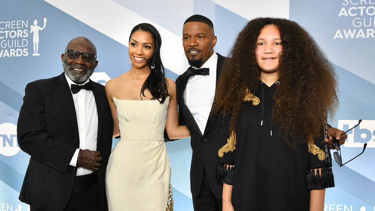 Left to right, George Dixon, Corinne Foxx, Jamie Foxx, and Anelise Bishop pose together