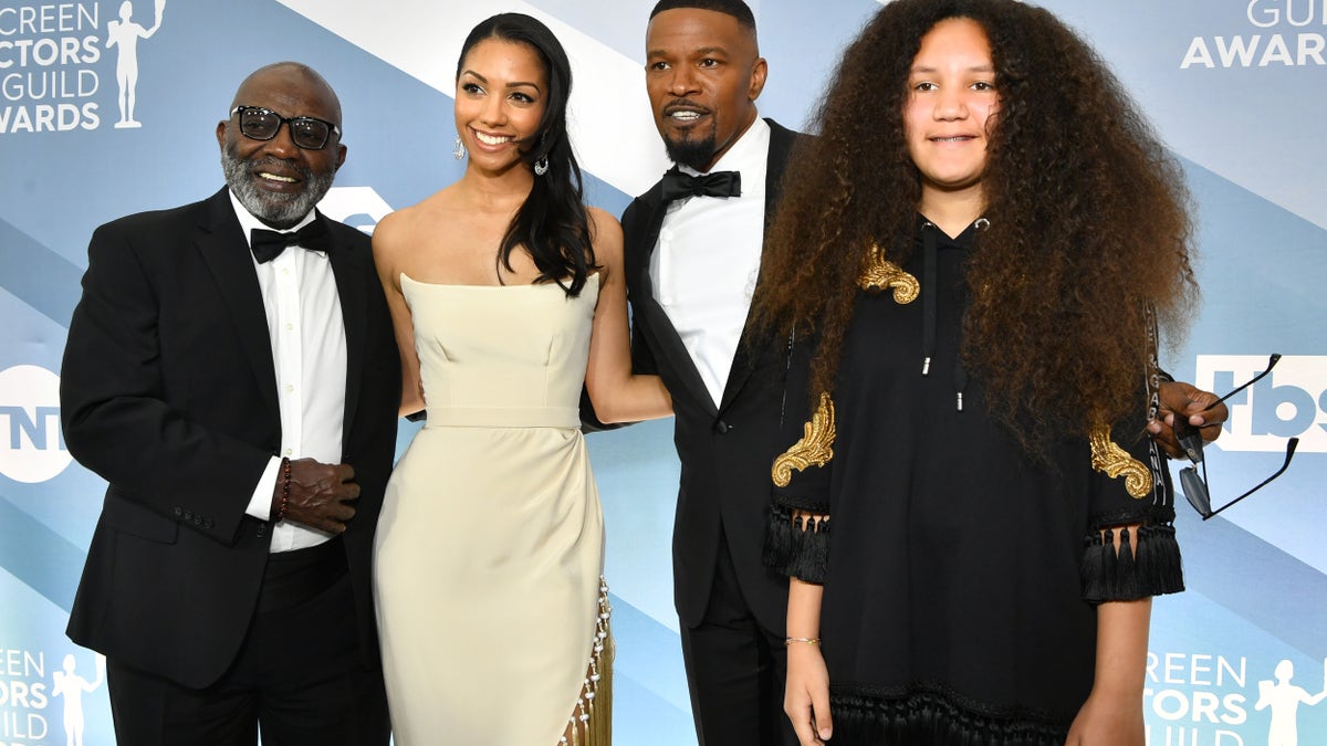 Left to right, George Dixon, Corinne Foxx, Jamie Foxx, and Anelise Bishop pose together