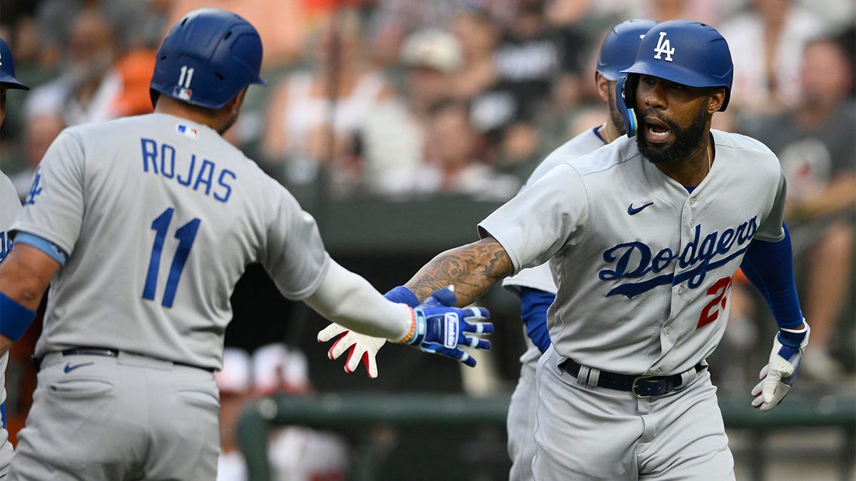 Jason Heyward celebrates with Miguel Rojas