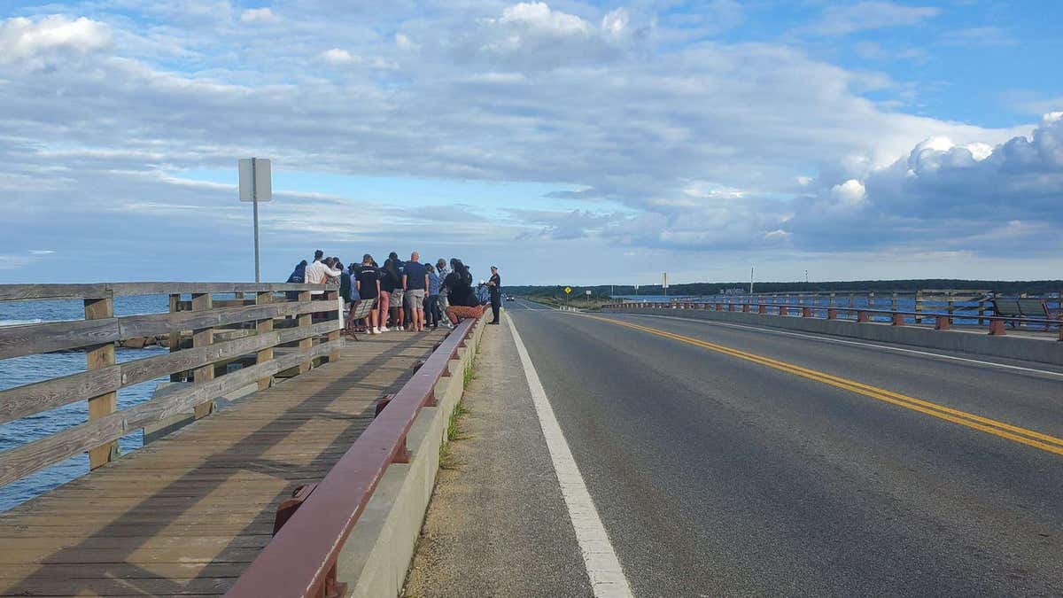 Mourners gather on Martha's Vineyard Jaws Bridge