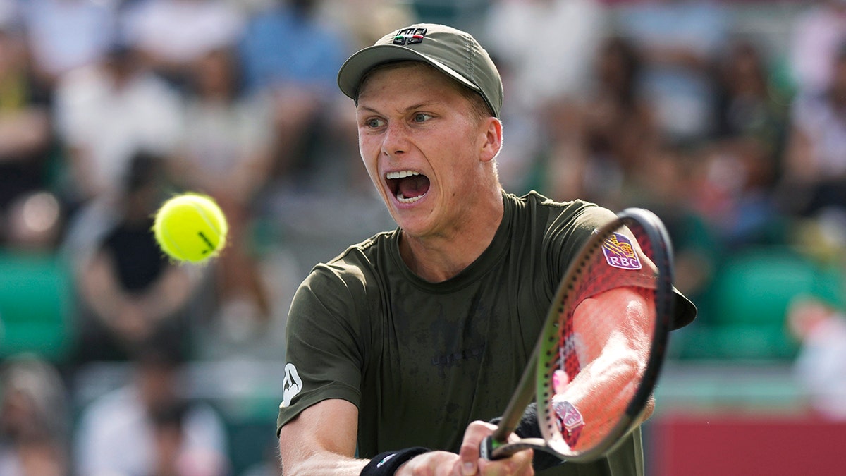 enson Brooksby during a tennis match