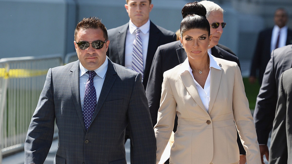 Joe and Teresa Giudice walking out of court