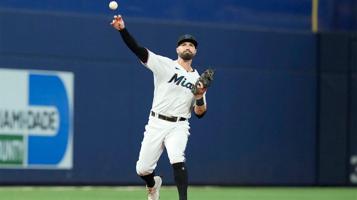 Joey Wendle of the Miami Marlins throws to first base against the