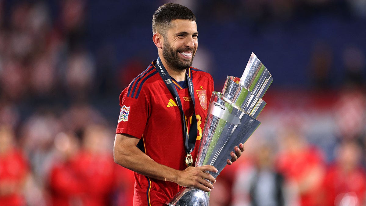 Jordi Alba holds UEFA Nations League Trophy