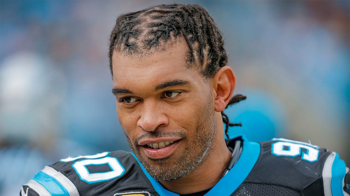 Julius Peppers looks on