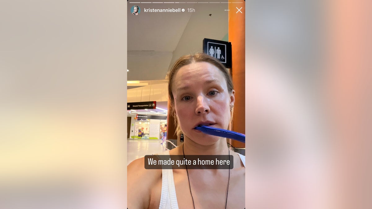 Kristen Bell has a toothbrush in her mouth as she walks through the airport with the caption "we made quite a home here"