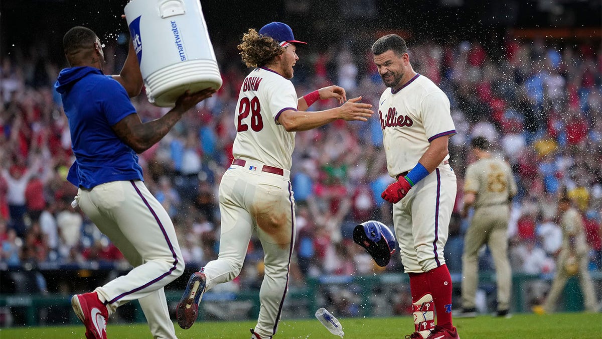 Kyle Schwarber celebrates with Alec Bohm