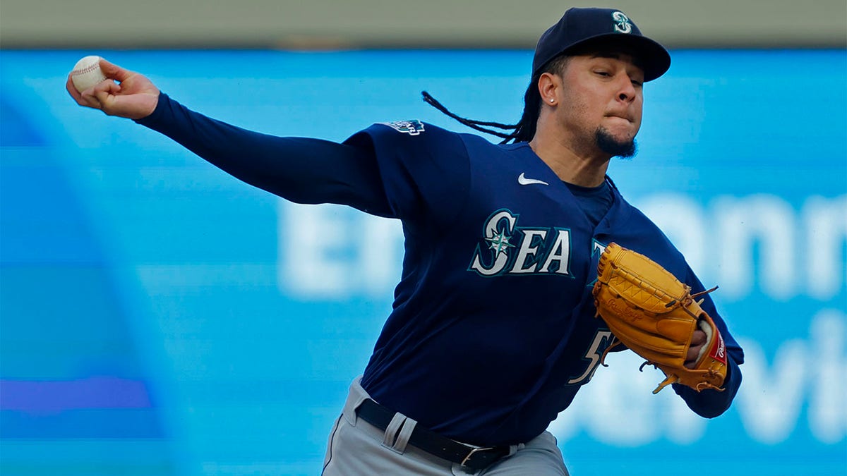 Luis Castillo throws pitch