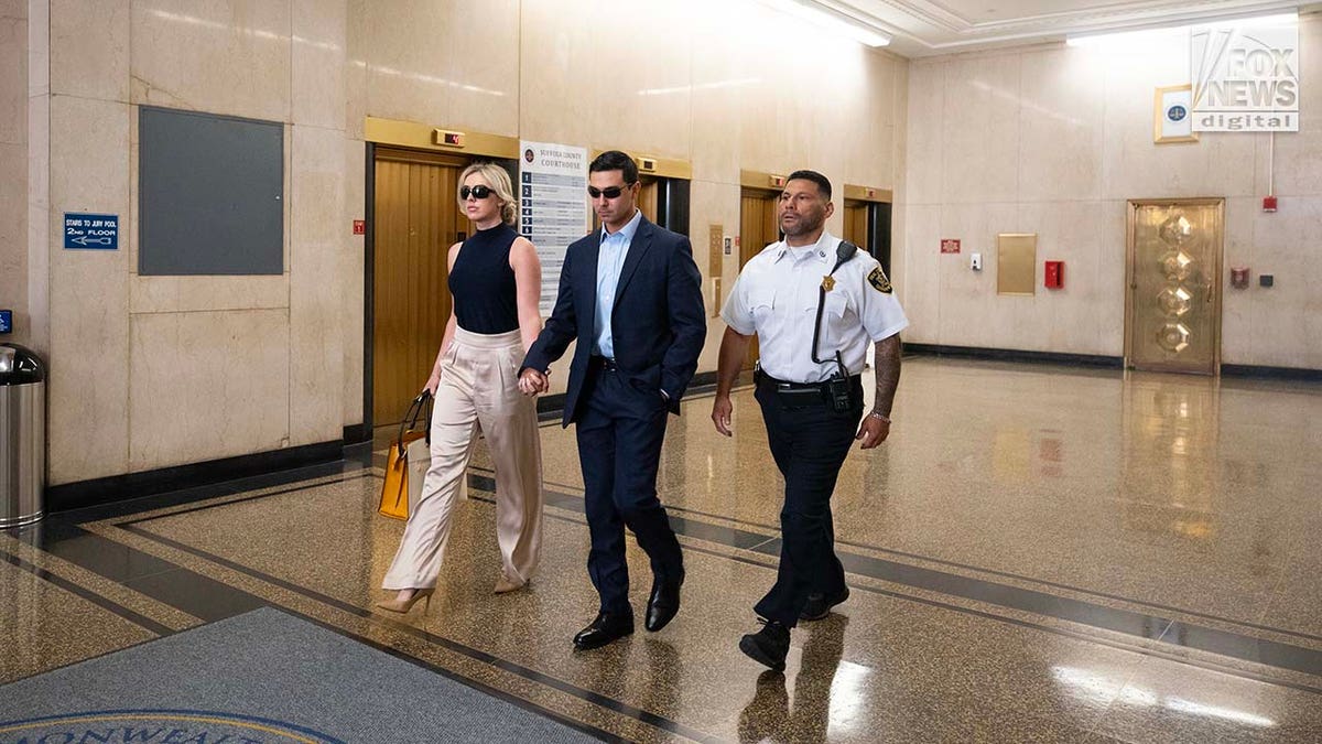 Accused rapist Matthew Nilo and fiancee, Laura Griffin walk together