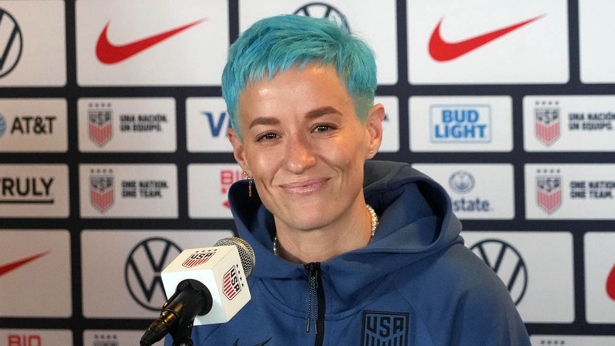 Megan Rapinoe talks to reporters