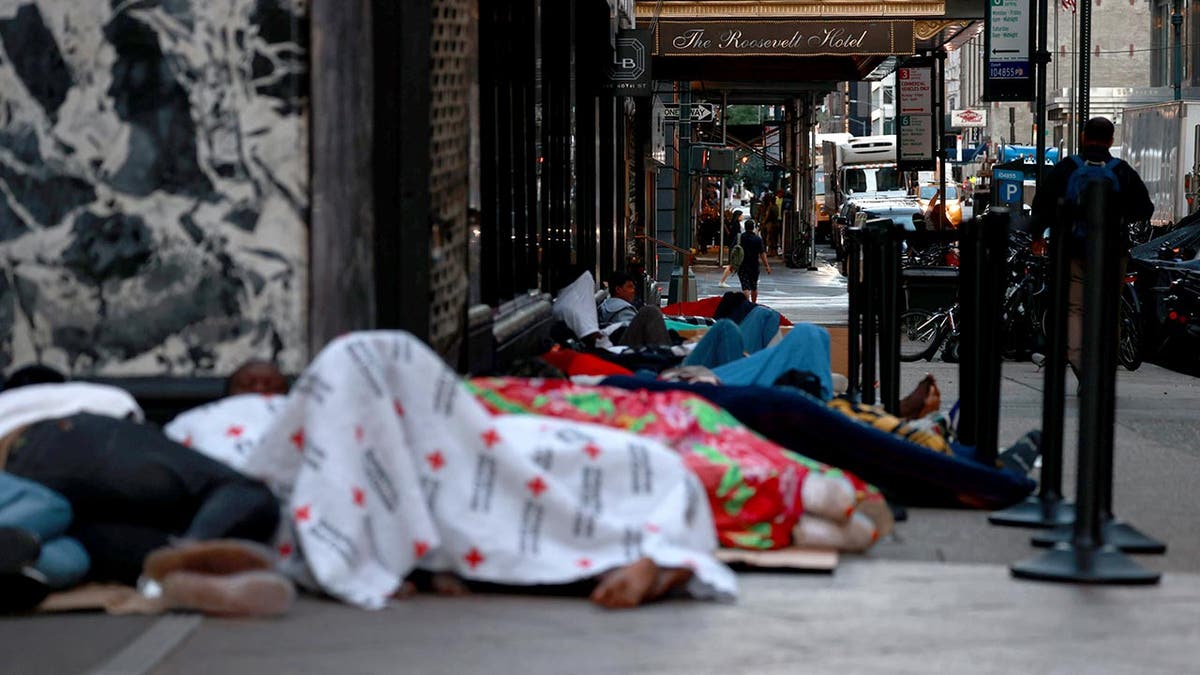 Migrants sleep on the street in New York City