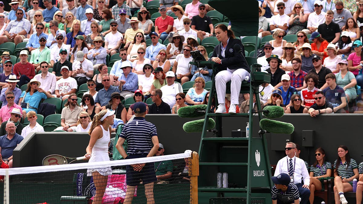 Mirra Andreeva talks with the umpire during her fourth round match at Wimbledon