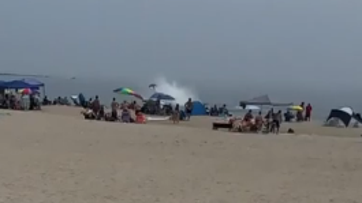 Tail of plane crashing into water