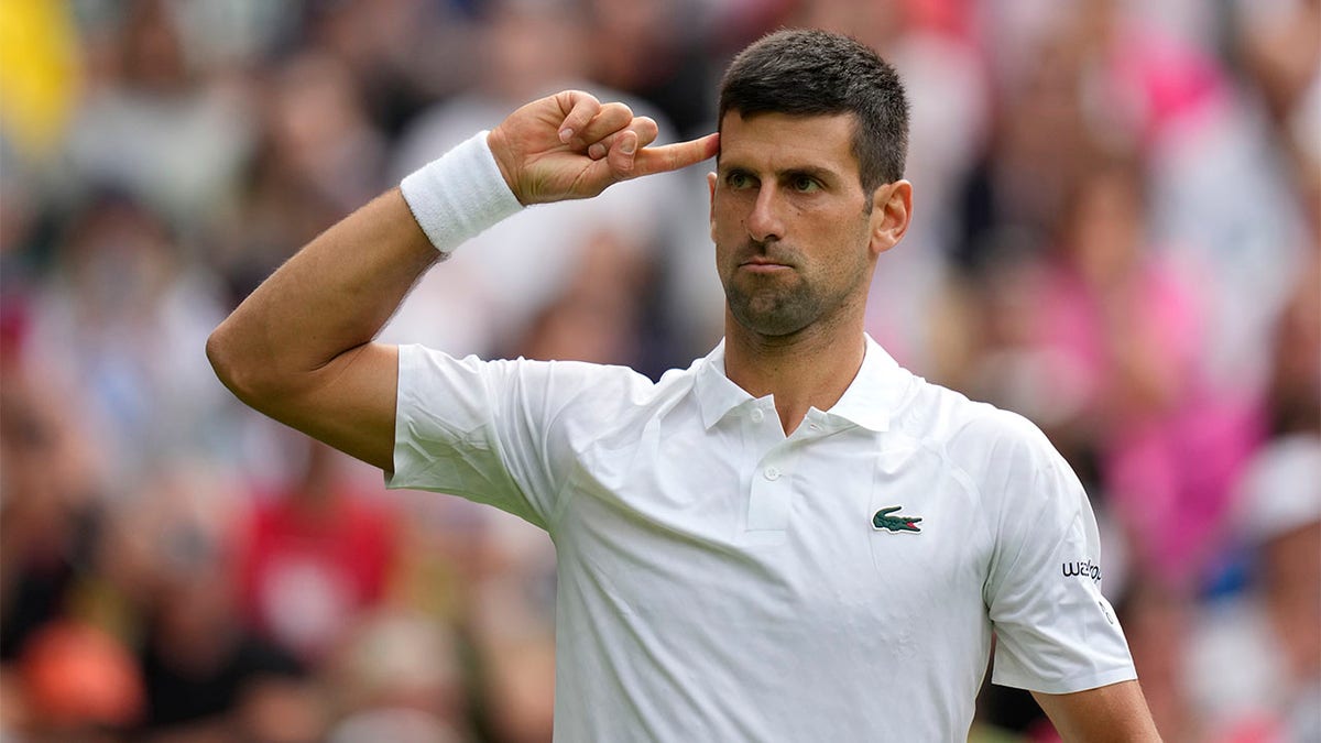 Novak Djokovic celebrates winning set