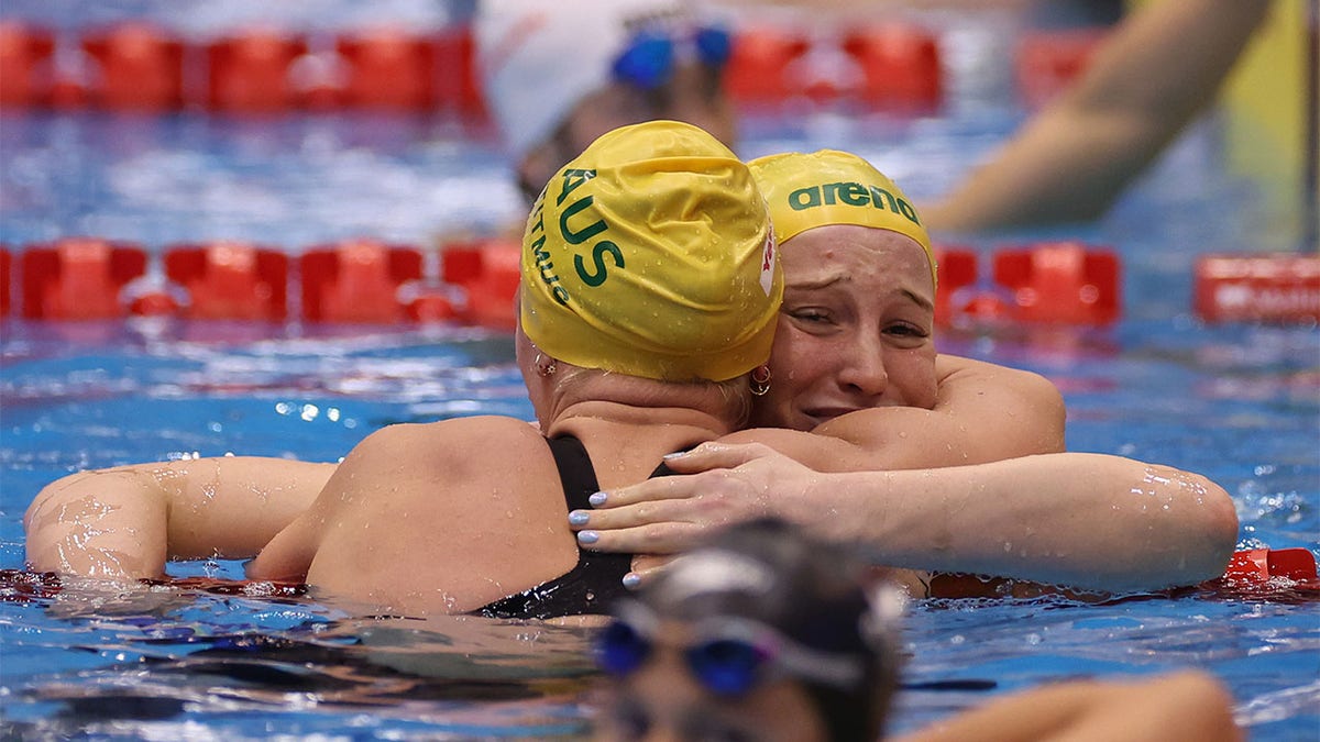 Mollie OCallaghan celebrates with Ariarne Titmus