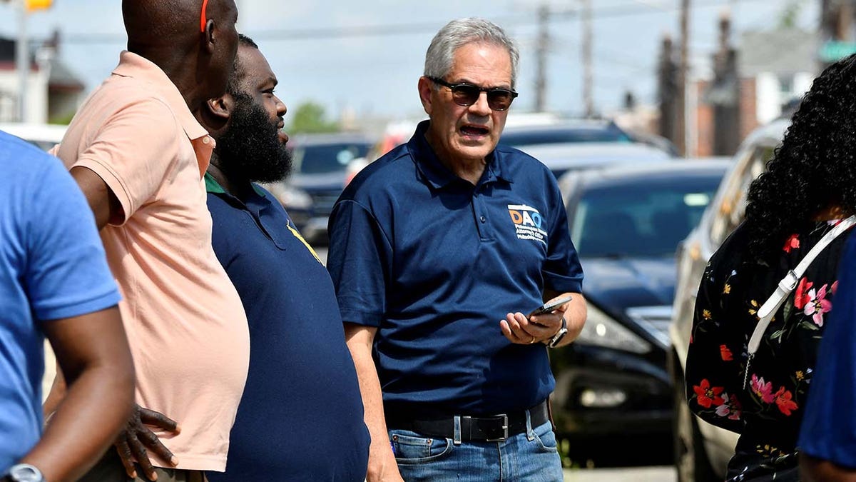 District Attorney Larry Krasner listens to community members