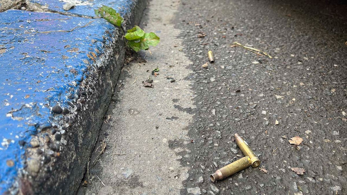 Spent shell casings are shown on the street in Philadelphia