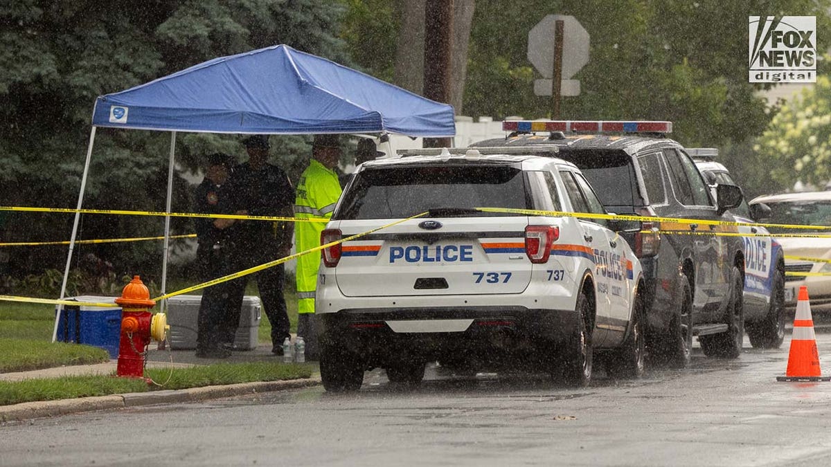 Authorities carry items out of Rex Heuermann's home in Massapequa Park