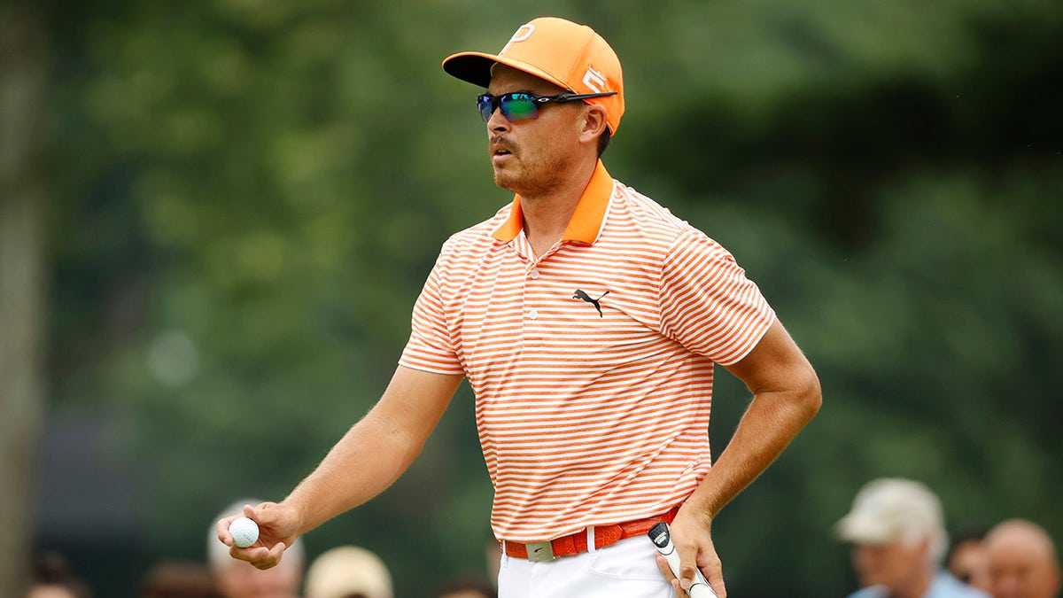 Rickie Fowler walks on course