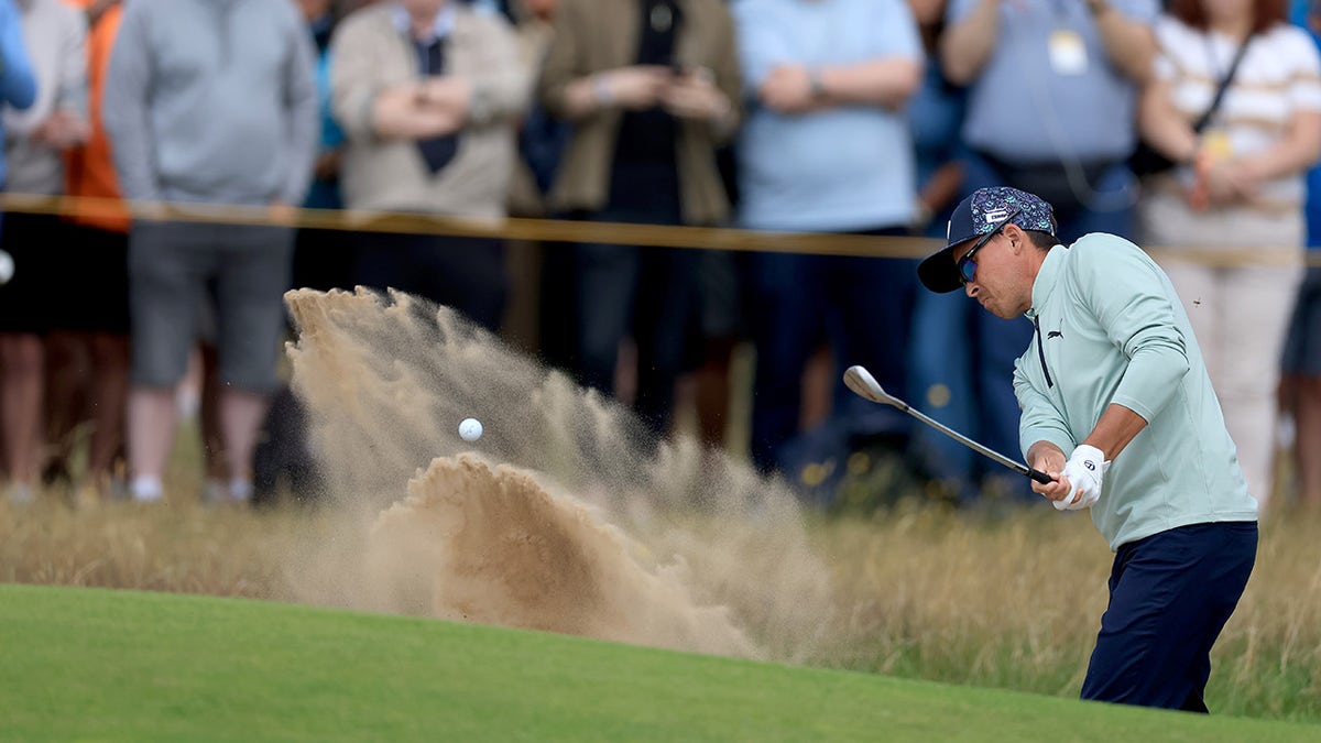 Rickie Fowler plays his third shot on the eighth hole