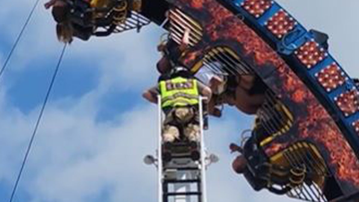 Firefighter helping stuck riders